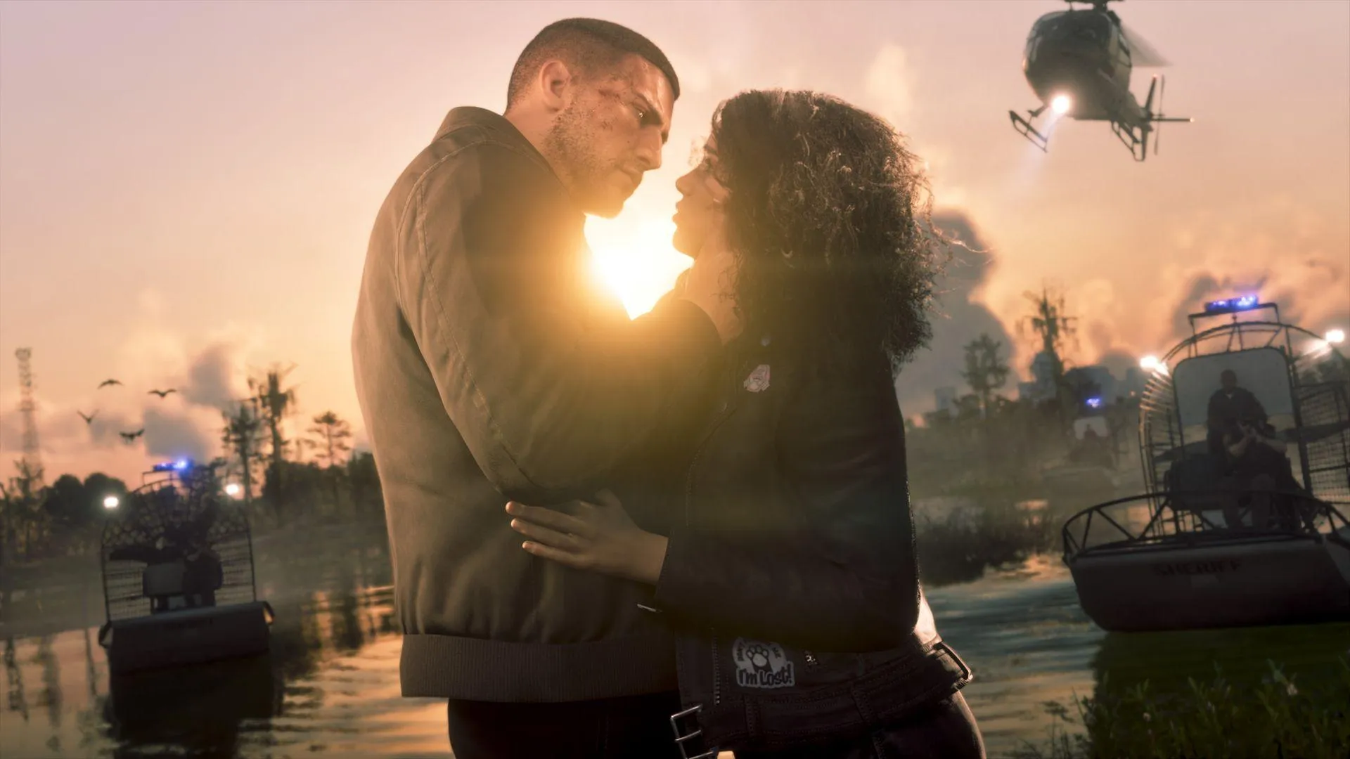 Jason and Lucia embracing at sunset as police close in